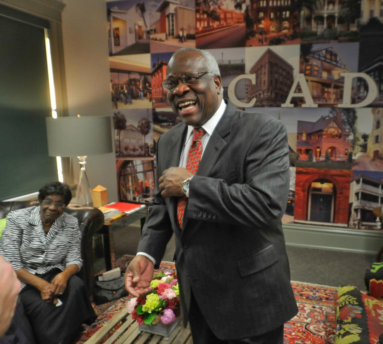 Leola Williams, left, listens as her son, Supreme Court Justice Clarence Thomas talks to the media after a ceremony on January 4, 2010 when SCAD's Historic Preservation Center was named in his honor.