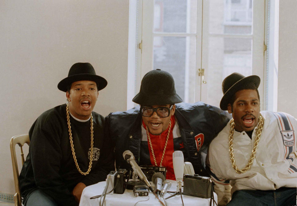 New York City rap trio Run-DMC is shown in a  London news conference, where they expressed hopes that there would be no repetition of the fighting that marred their recent appearance in California, Sept. 12, 1986. From left: Joseph Simmons (Run), Darryl McDaniels (DMC), and Jason Mizell (Jam Master Jay).  (AP Photo/Peter Kemp)