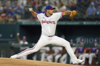 Texas Rangers starting pitcher Dane Dunning throws during the first inning of the team's baseball game against the Seattle Mariners in Arlington, Texas, Saturday, Aug. 13, 2022. (AP Photo/LM Otero)