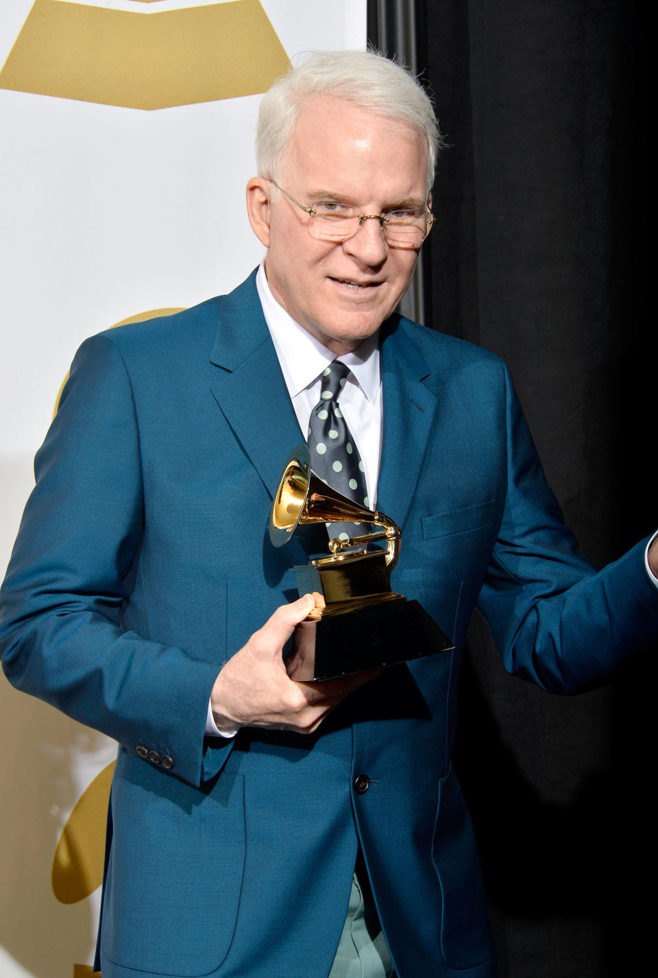 Steve Martin holding a Grammy