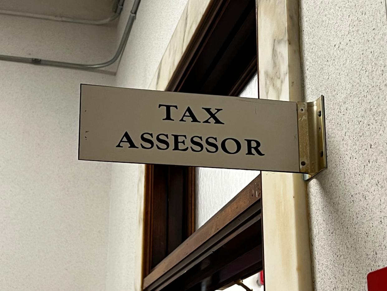 A sign on the first floor of Newport City Hall informs visitors of the Tax Assessor office.