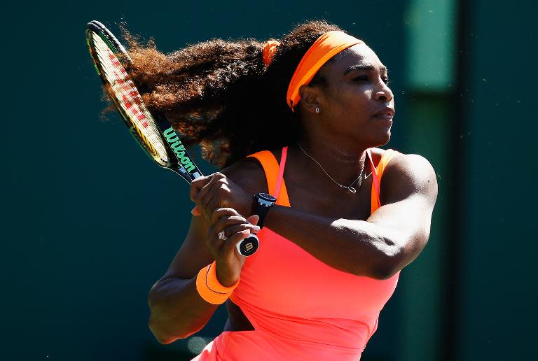 Serena Williams returns the ball to Catherine Bellis during the Miami Open on March 29, 2015 in Key Biscayne, Florida