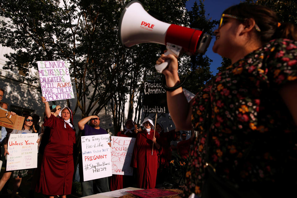 Pro-choice supporters protest in front of the Alabama State House 