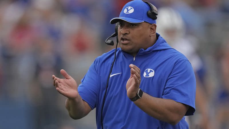 BYU coach Kalani Sitake talks to his team during game against Kansas on Sept. 23, 2023, in Lawrence, Kan. The Cougars have a bye next but will be back in action on Oct. 14 when they face TCU in Fort Worth, Texas.
