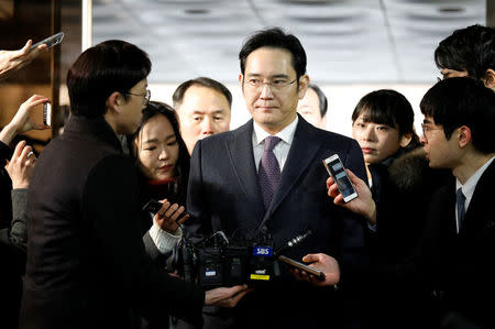 FILE PHOTO - Samsung Group chief, Jay Y. Lee, is surrounded by media as he arrives at the Seoul Central District Court in Seoul, South Korea, January 18, 2017. REUTERS/Kim Hong-Ji/File Photo