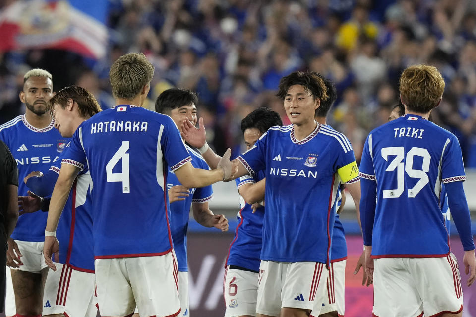 Yokohama F. Marinos players celebrate their victory at the end of the first leg of the AFC Champions League final soccer match between Al Ain and Yokohama F. Marinos in Yokohama, Japan, Saturday, May 11, 2024. (AP Photo/Eugene Hoshiko)
