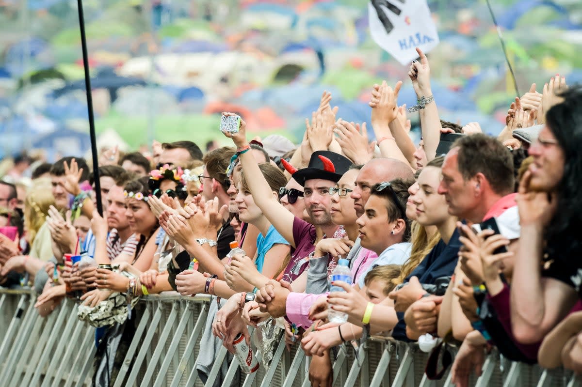 Festival-goers (Ben Birchall/PA) (PA Archive)