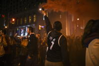 Toronto Raptors fans gather in the streets of Toronto early Friday, June 14, 2019, following the team's 114-110 win over the Golden State Warriors in Oakland, Calif., in Game 6 of basketball's NBA Finals. (Tijana Martin/The Canadian Press via AP)