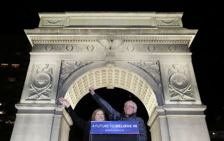 U.S. Democratic presidential candidate and U.S. Senator Bernie Sanders and his wife Jane (L) acknowledge supporters at a campaign rally in Washington Square Park in the Greenwich Village neighborhood of New York City, April 13, 2016. REUTERS/Brian Snyder