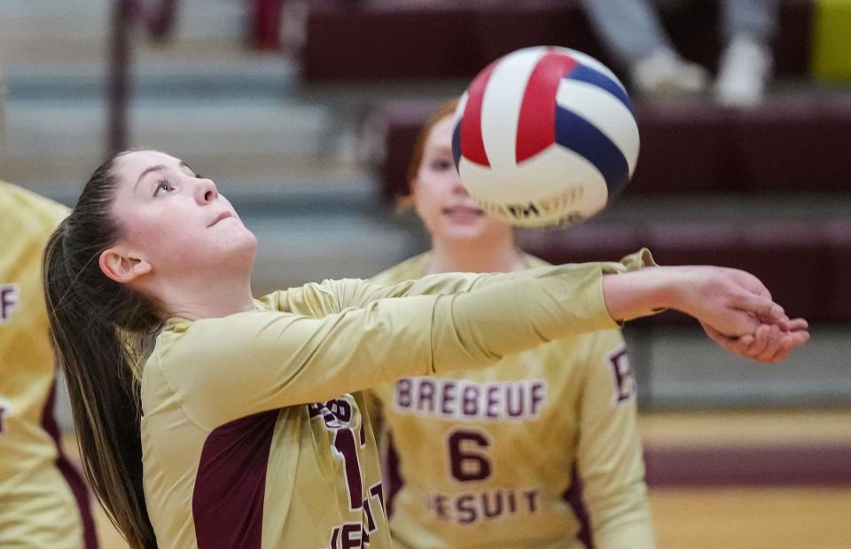 Brebeuf Jesuit middle hitter Reese Blanchard (13) hits the ball Thursday, Sept. 14, 2023, during the game against the Center Grove Trojans at Brebeuf Jesuit Preparatory School in Indianapolis. The Center Grove Trojans defeated Brebeuf Jesuit, 3-2.