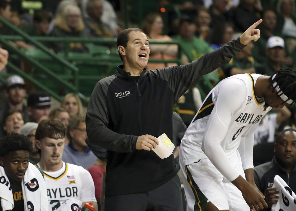 Baylor head coach Scott Drew instructs his players in the second half of an NCAA college basketball game against Stanford, Saturday, Nov. 20, 2021, in Waco, Texas. (AP Photo/Jerry Larson)