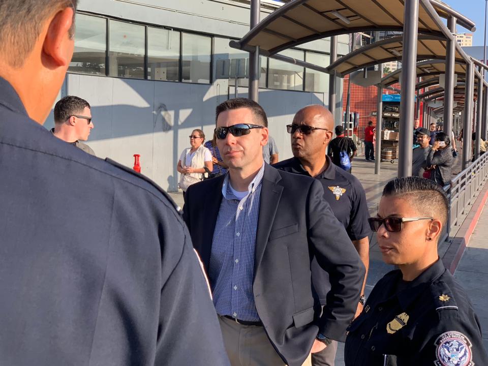 U.S. Customs and Border Protection Commissioner Kevin McAleenan (center) receives a briefing at the San Ysidro Port of Entry in San Diego, Calif., on October 26, 2018.