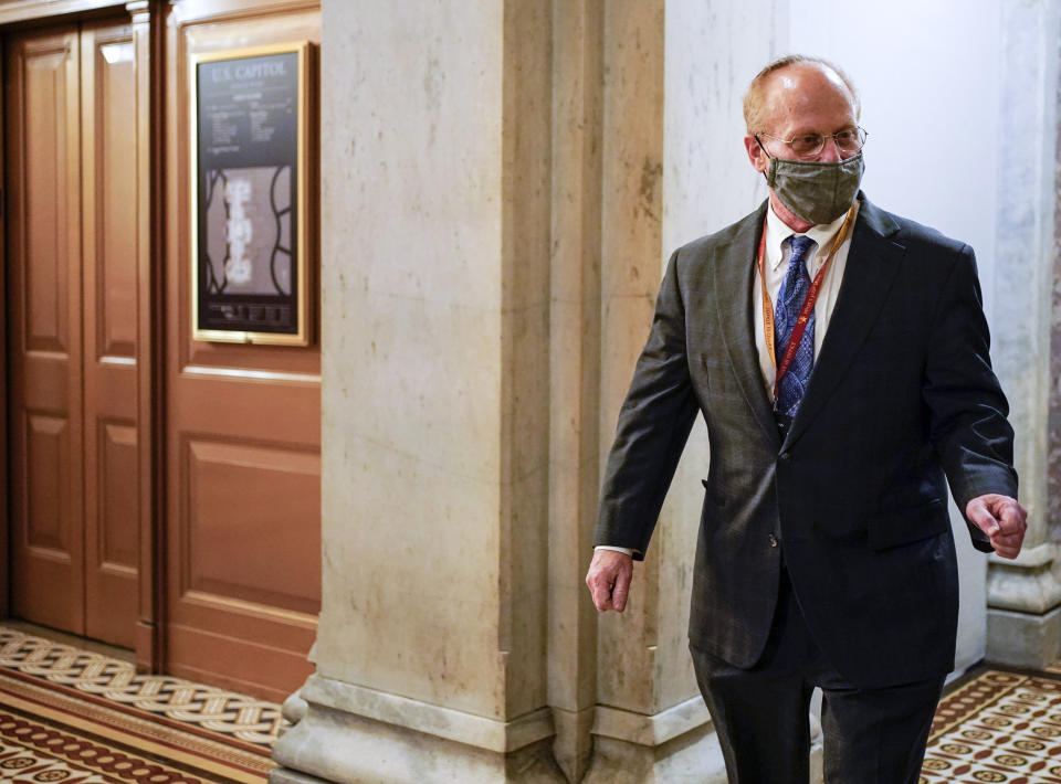 David Schoen, lawyer for former President Donald Trump, walks on Capitol Hill during a break in the second impeachment trial of Trump, at the Capitol, Wednesday, Feb. 10, 2021 in Washington. (Joshua Roberts/Pool via AP)