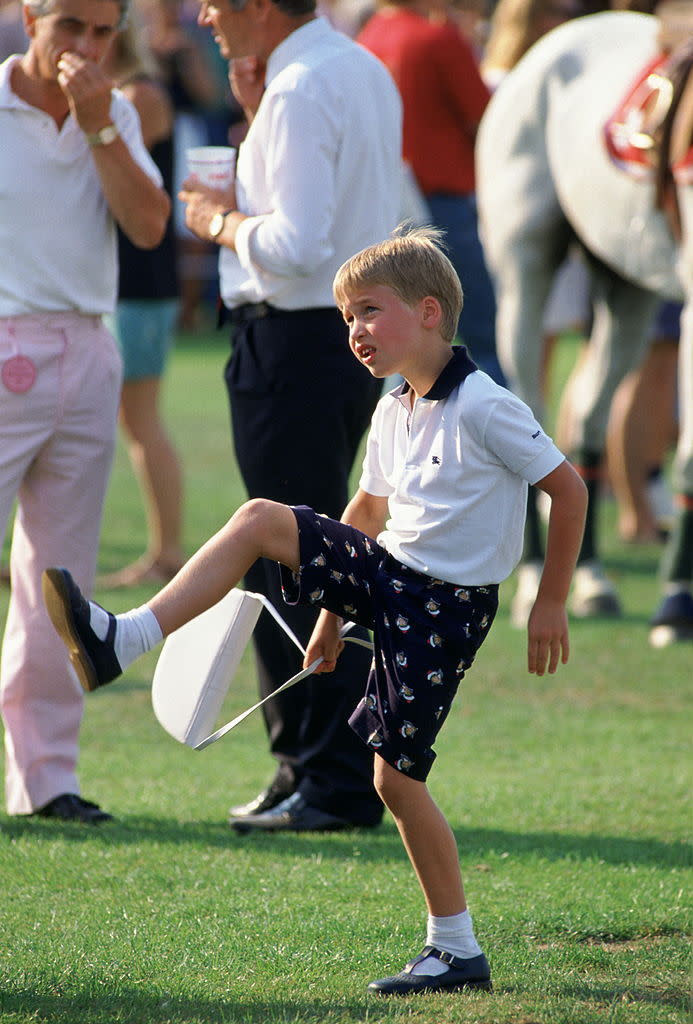 <p>More interested in mom’s purse than the polo match. <i>(Photo by Tim Graham/Getty Images)</i></p>