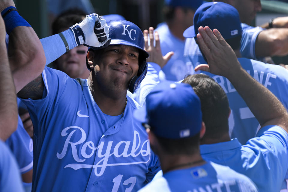 The Kansas City Royals' Salvador Perez (13) celebrates with teammates after his home run against the Houston Astros during the sixth inning of a baseball game, Sunday, June 5, 2022, in Kansas City, Mo. (AP Photo/Reed Hoffmann)
