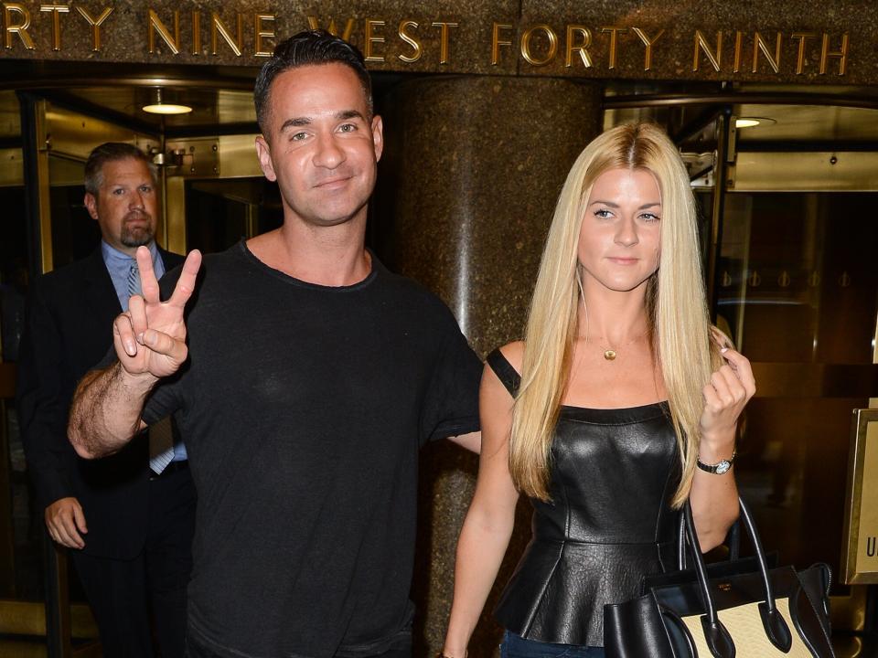 Mike Sorrentino (L) and Lauren Pesce leave the Rockefeller Center Studios on September 4, 2014 in New York City