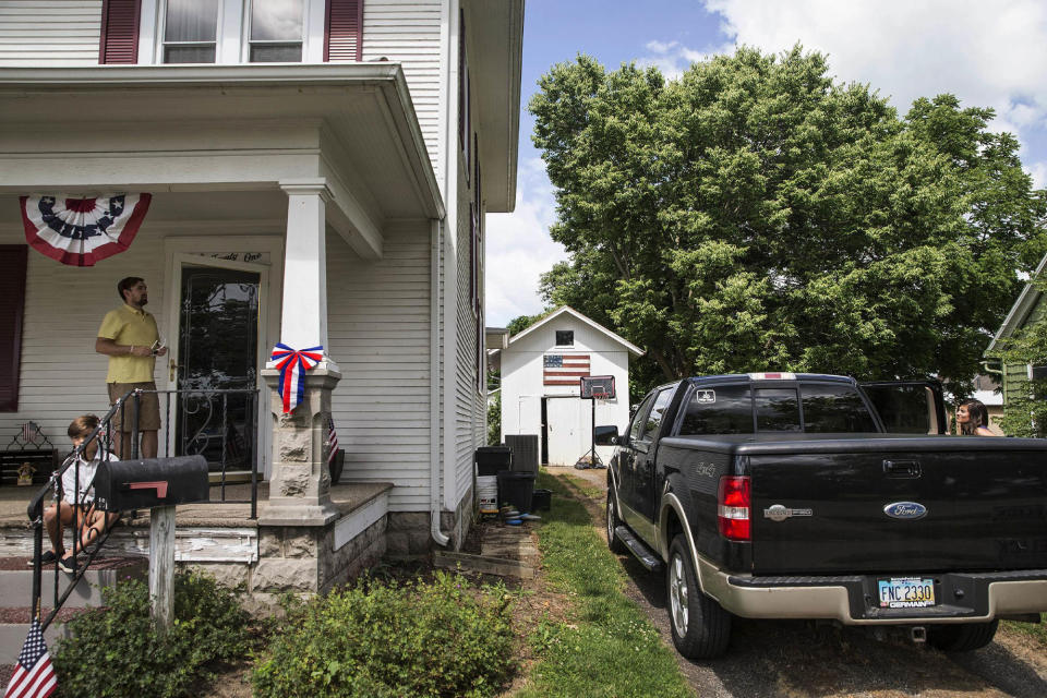 <p>Bill Clay, left, and his wife, Kristi, right, prepare to leave for church from their home in Ashville, Ohio, on Saturday, July 9, 2016. “If we’re going to try to be Christian-like, and embrace people, I don’t think you can shut the borders to an entire group of people just because of the fear that some of them don’t like us,” says Bill, who voted for Barack Obama in the last two elections but supported Republican Marco Rubio this time. (AP Photo/John Minchillo) </p>