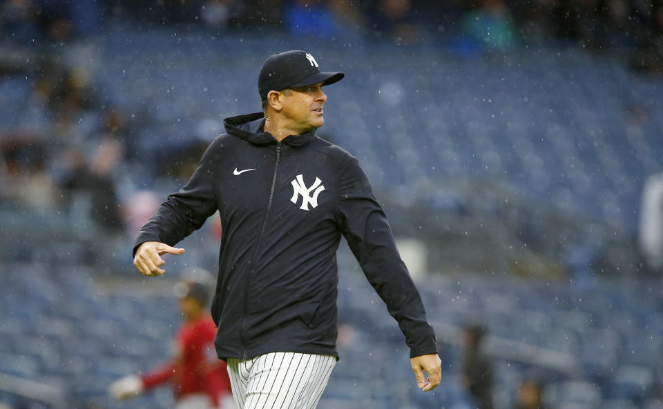 New York Yankees manager Aaron Boone walks back to the dugout after visiting the mound during a baseball game against the Arizona Diamondbacks, Sept. 24, 2023, in New York. (AP Photo/John Munson)