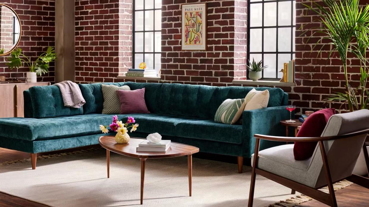 a living room with a blue couch