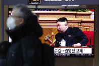 A man wearing a face mask walks past near a TV screen showing a footage of North Korean leader Kim Jong Un, at the Seoul Railway Station in Seoul, South Korea, Monday, Jan. 11, 2021. Kim was given a new title, “general secretary” of the ruling Workers’ Party, formerly held by his late father and grandfather, state media reported Monday, in what appears to a symbolic move aimed at bolstering his authority amid growing economic challenges. (AP Photo/Lee Jin-man)