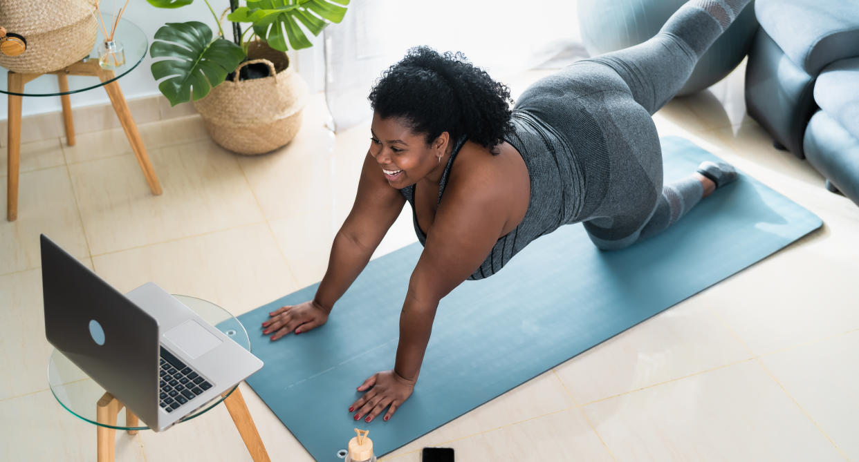 woman does cosy cardio exercises at home