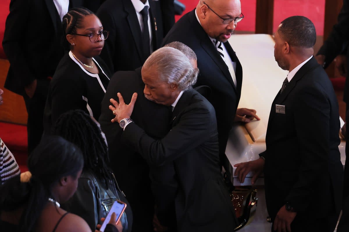 Andre Zachery, father of Jordan Neely, embraces the Reverend Al Sharpton at the conclusion of his son's public viewing and funeral service at Mount Neboh Baptist Church on May 19, 2023 in New York City (Getty Images)