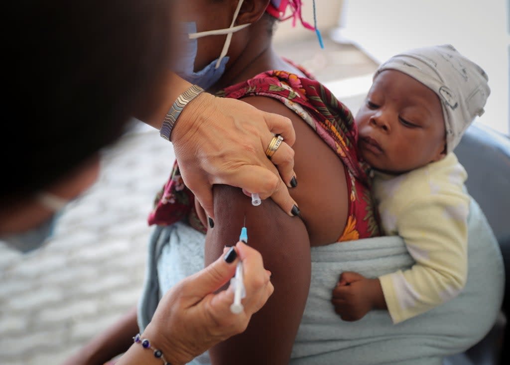 A woman being given the Covid vaccine in South Africa  (REUTERS)