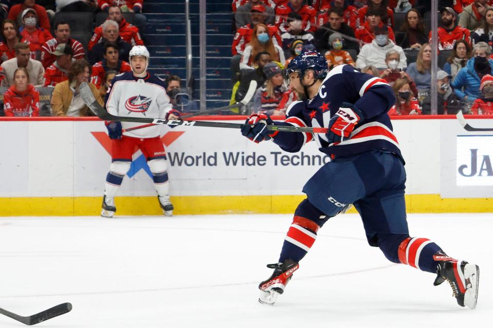 Dec 4, 2021; Washington, District of Columbia, USA; Washington Capitals left wing Alex Ovechkin (8) shoots the puck against the Columbus Blue Jackets during the first period at Capital One Arena. Mandatory Credit: Geoff Burke-USA TODAY Sports