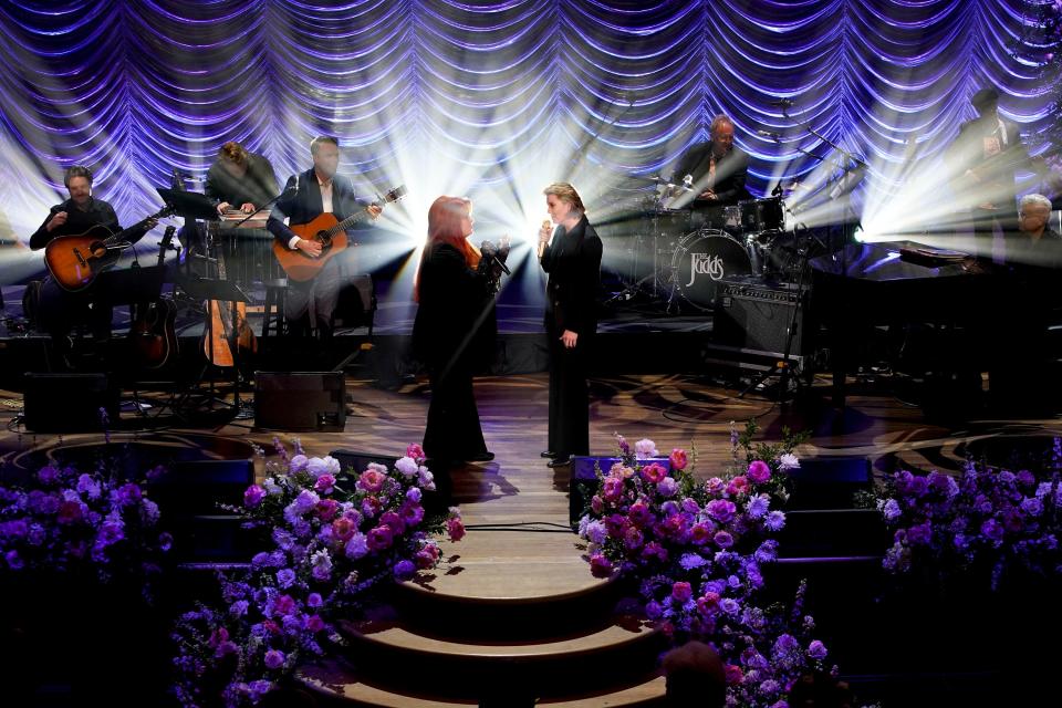 Wynonna Judd and Brandi Carlile perform together at the Ryman Auditorium to honor the memory of Judd's mother, Naomi Judd, during the A River of Time Celebration in Nashville, Tenn., on Sunday, May 15, 2022.