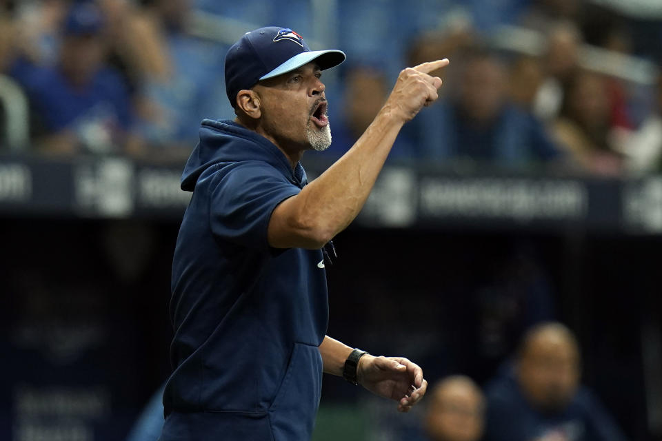 Toronto Blue Jays pitching coach Pete Walker yells at umpires after starting pitcher Ryan Borucki was ejected after hitting Tampa Bay Rays' Kevin Kiermaier with a pitch during the eighth inning of a baseball game Wednesday, Sept. 22, 2021, in St. Petersburg, Fla. (AP Photo/Chris O'Meara)