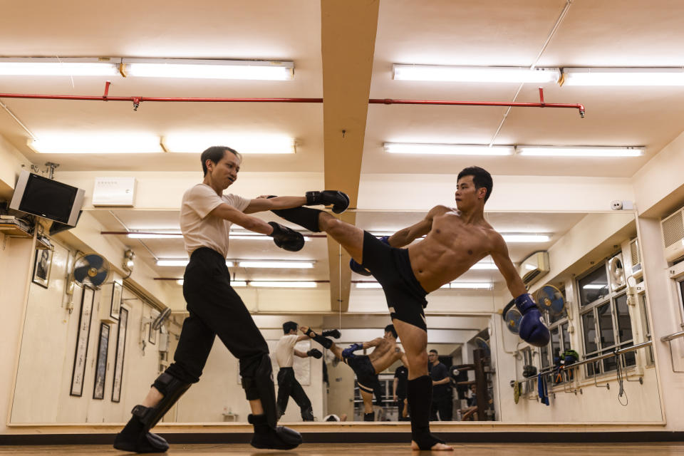 Practitioners train during a Jeet Kune Do class in Hong Kong, Wednesday, July 19, 2023. (AP Photo/Louise Delmotte)