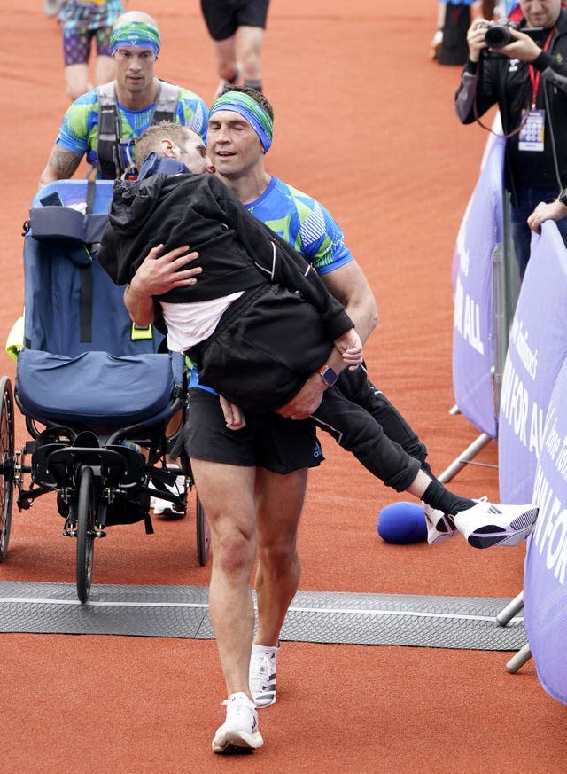 Kevin Sinfield carried Rob Burrow across the finish line at the Rob Burrow Leeds Marathon in April after pushing his great friend and former Rhinos teammate for 26.2 miles. 