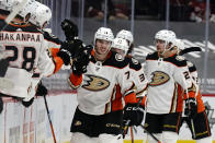 Anaheim Ducks defenseman Josh Mahura (76) celebrates with teammates after scoring a goal against the Arizona Coyotes during the second period of an NHL hockey game Wednesday, Feb. 24, 2021, in Glendale, Ariz. (AP Photo/Rick Scuteri)