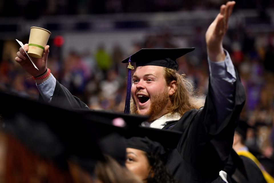 Ben Blessing of Maryland cheers at the commencement.