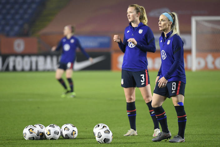United States&#39; Julie Ertz, right, and United States&#39; Samantha Mewis warm up prior to the international friendly women&#39;s soccer match between The Netherlands and the US at the Rat Verlegh stadium in Breda, southern Netherlands, Friday Nov. 27, 2020. (Piroschka van de Wouw/Pool via AP)