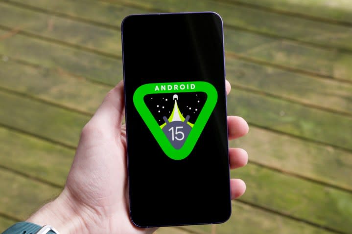 The Android 15 logo on a smartphone.