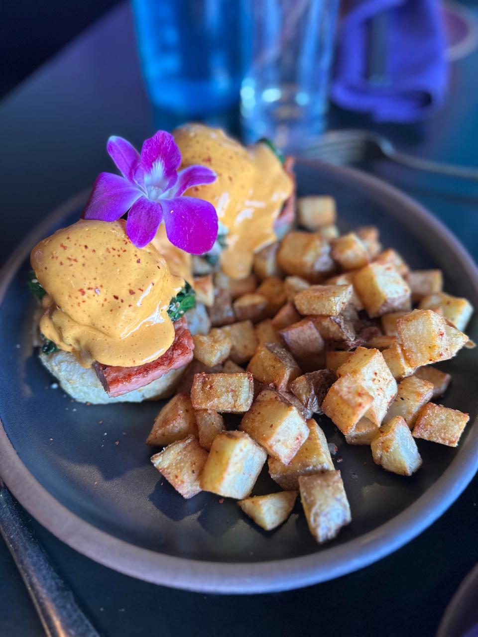 RosaBees' new brunch menu features Broke Da Mouth Benne, made with poached free range eggs, teriyaki glazed house made spam or organic tofu, spinach gomae, a honeycomb biscuit, chili Lilikoi hollandaise and served with chili-garlic home fries.