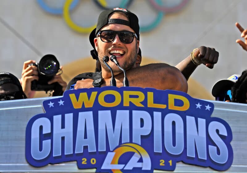 Los Angeles, California February 16, 2022: Rams quarterback Matthew Stafford celebrates their Super Bowl championship in front of the Coliseum Wednesday. (Wally Skalij/Los Angeles Times)