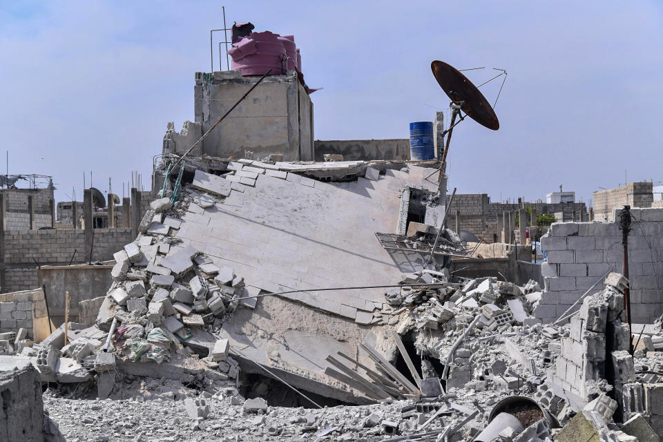 This photo released by the Syrian official news agency SANA, shows the rubble of a house that according to the Syrian authorities was attacked by an Israeli airstrike, in the Damascus suburbs of Hajira, Syria, Monday, April 27, 2020. The Syrian military and state media said Monday that Israeli warplanes flying over Lebanon fired missiles toward areas near the Syrian capital of Damascus, killing three civilians. An opposition war monitor says four Iran-backed fighters were also killed. The military says Syrian air defenses shot some of the missiles down. The reports said the attack happened around dawn on Monday. (SANA via AP)