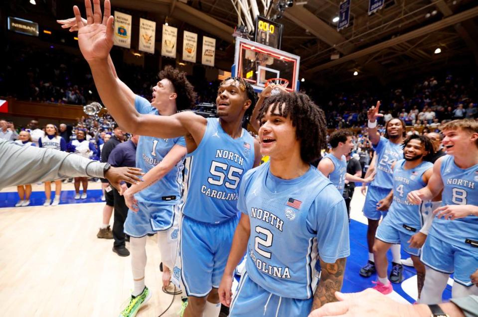 North Carolina’s Harrison Ingram (55) and North Carolina’s Elliot Cadeau (2) motion to the Cameron Crazies after UNC’s 84-79 victory over Duke at Cameron Indoor Stadium in Durham, N.C., Saturday, March 9, 2024.