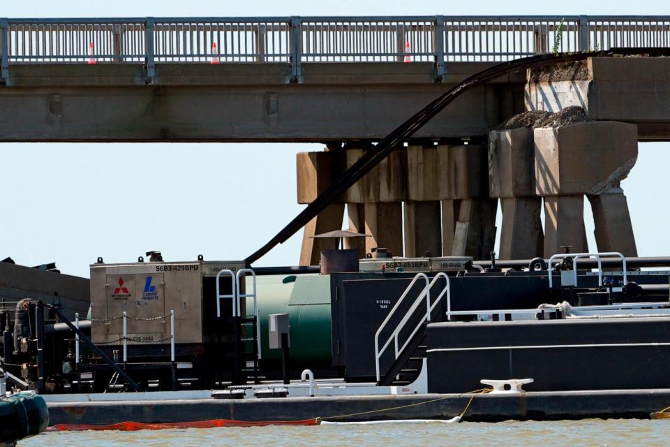 PHOTO: A section of railroad track hangs down from Pelican Island Bridge after a barge crashed into the bridge, May 15, 2024, in Galveston, Texas. (David J. Phillip/AP)