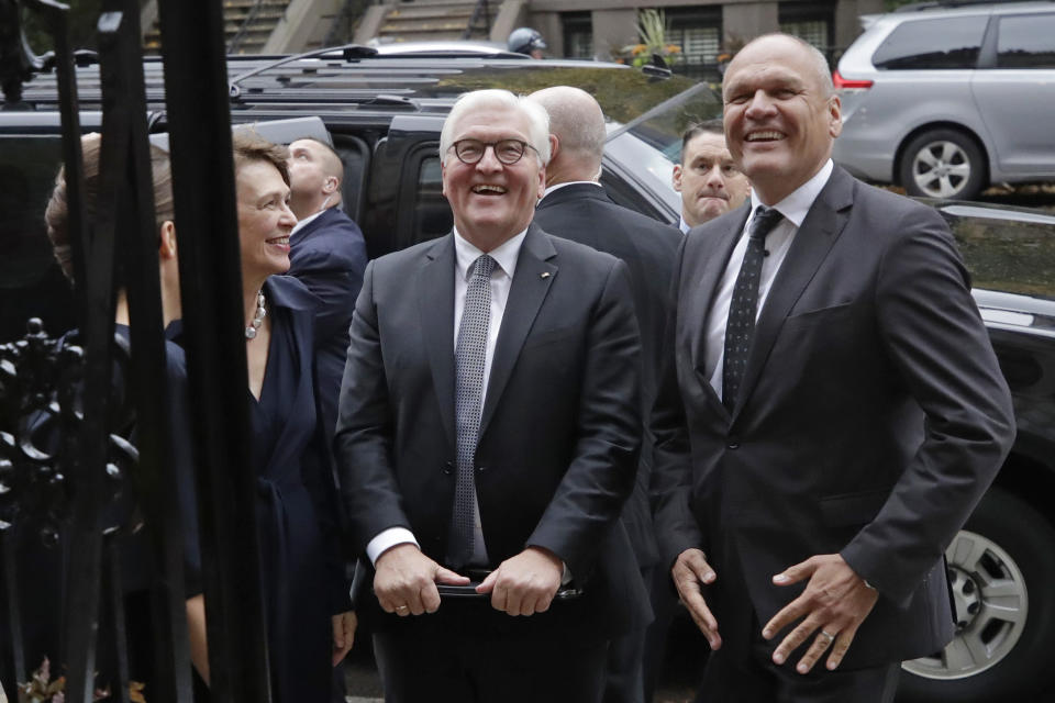 German President Frank-Walter Steinmeier, center, smiles with his wife, Elke Budenbender, left, and Goethe Institute Secretary General Johannes Ebert, right, as they arrive at the Goethe Institute, Thursday, Oct. 31, 2019, in Boston. (AP Photo/Elise Amendola)