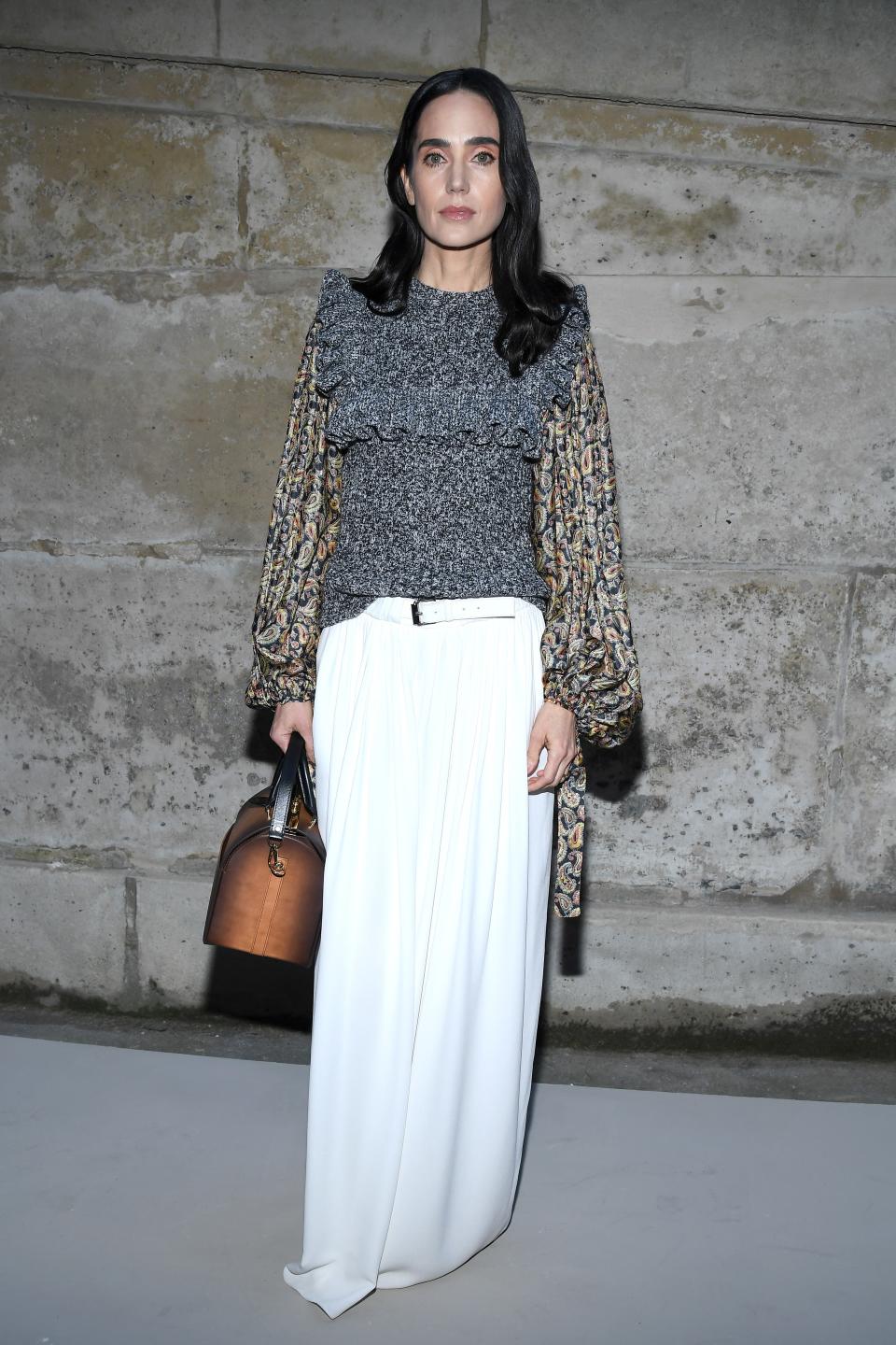 <p>WHO: Jennifer Connelly</p> <p>WHAT: Louis Vuitton</p> <p>WHERE: At the Louis Vuitton Fall 2018 show, Paris</p> <p>WHEN: March 6, 2018</p>