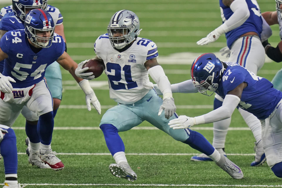 Dallas Cowboys' Ezekiel Elliott runs the ball during the first half of an NFL football game against the New York Giants, Sunday, Jan. 3, 2021, in East Rutherford, N.J. (AP Photo/Frank Franklin II)