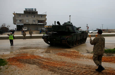 A Turkish military tank arrives at an army base in the border town of Reyhanli near the Turkish-Syrian border in Hatay province, Turkey January 17, 2018. REUTERS/Osman Orsal