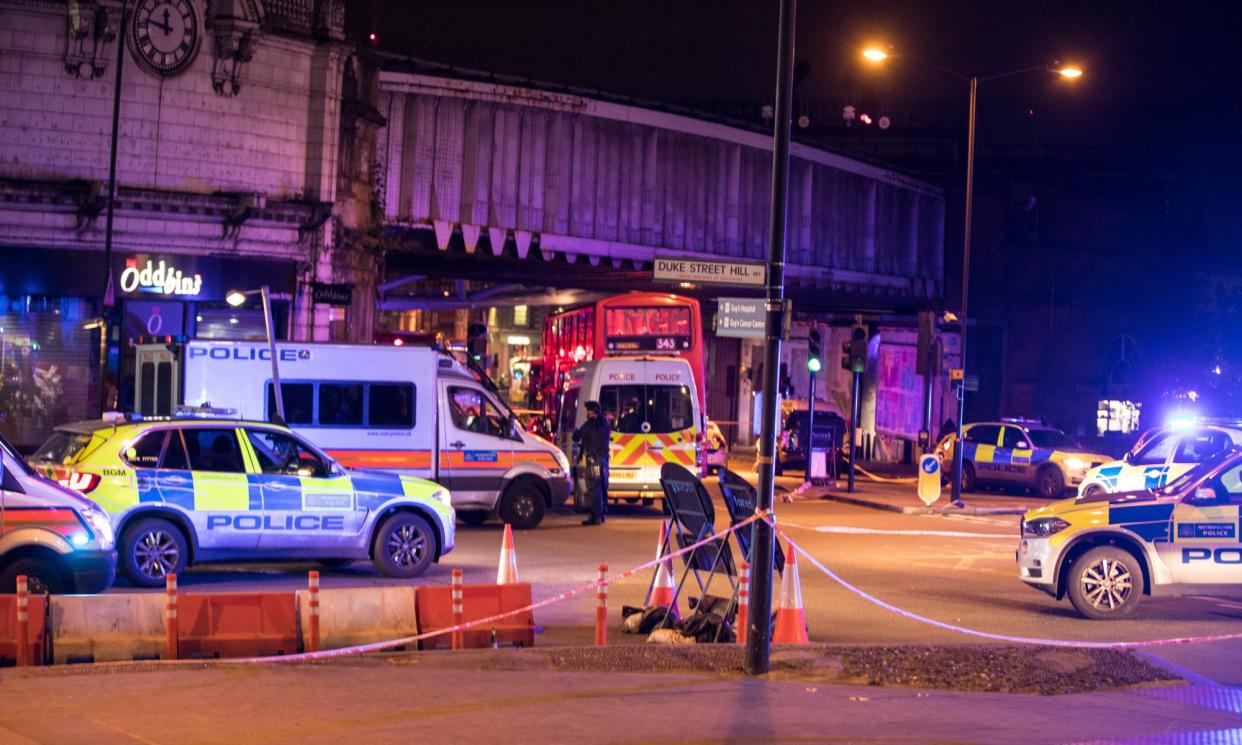 <span>Police at the scene of the London Bridge attack. </span><span>Photograph: Rob Pinney/LNP</span>