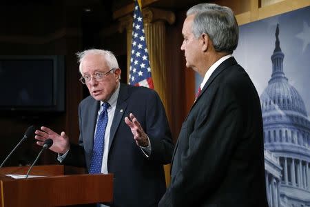 U.S. Senate Veterans' Affairs Committee Chairman Bernie Sanders (I-VT) (L) and House Veterans' Affairs Committee Chairman Jeff Miller (R-FL) announce bipartisan legislation to address problems in the VA health care system, at the U.S. Capitol in Washington July 28, 2014. REUTERS/Jonathan Ernst