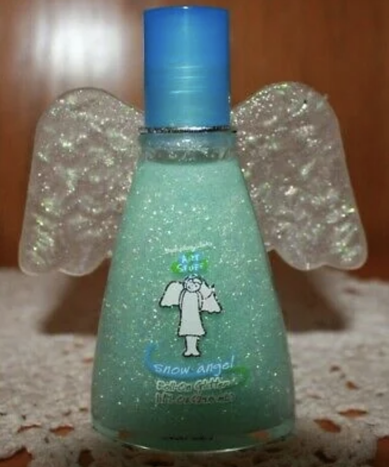 Glittery bottle with angel wing attachments and labeled "Snow angel" with a cartoon figure