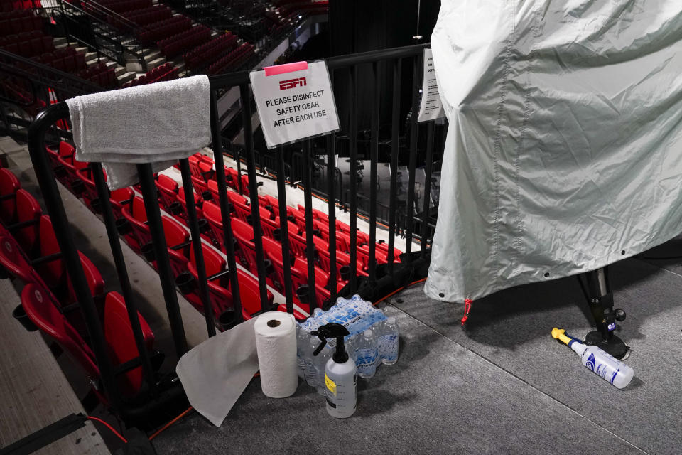 Disinfectant spray sits near television cameras inside a basketball arena at ESPN Wide World of Sports Complex Wednesday, July 29, 2020, in Orlando, Florida.  (Photo: AP Photo/Ashley Landis)