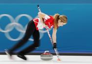 <p>Kaitlyn Lawes of Canada sweeps. REUTERS/Cathal McNaughton </p>